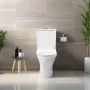 Invena Dokos kompakt perem nélküli monoblokk WC csésze alsó bekötésű tartállyal és Soft-Close WC ülőkével, fehér kivitelben.